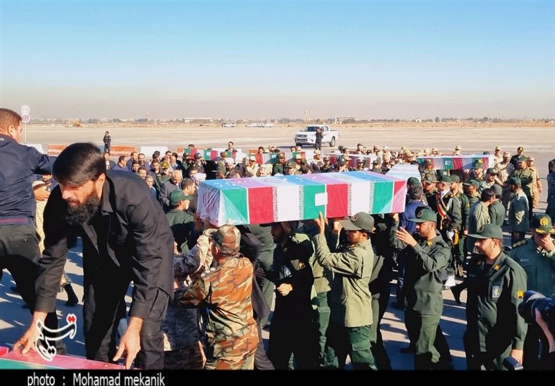 پیکر مطهر 14 شهید گمنام دفاع وارد مشهد شد + فیلم و تصاویر